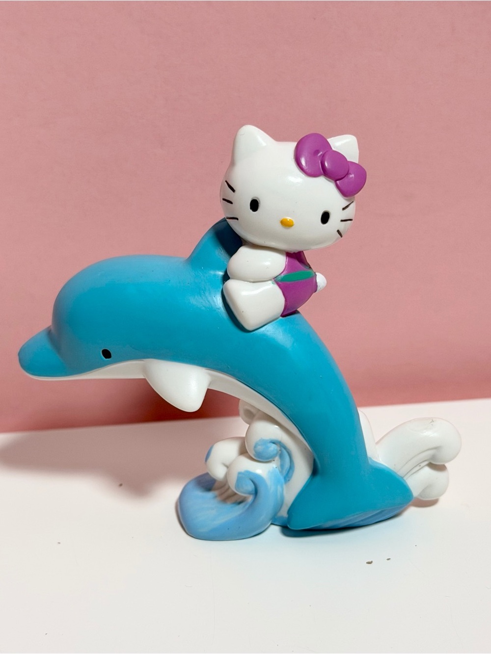 Vintage Sanrio hello kitty on dolphin figurine